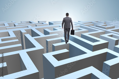 Businessman trying to escape from maze