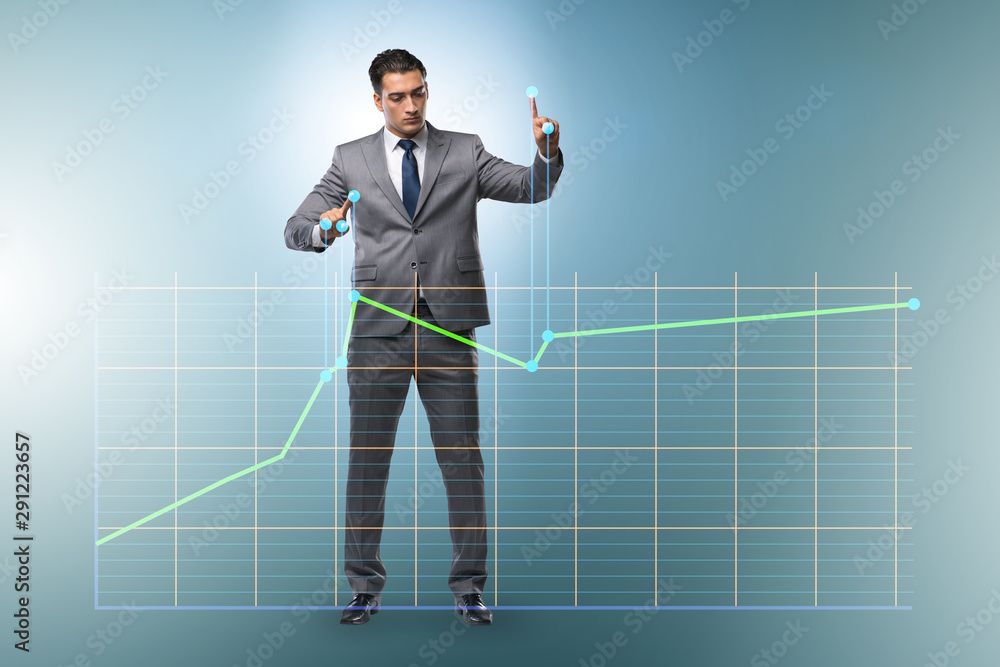 Businessman controlling the market with strings Businessman controlling the market with strings