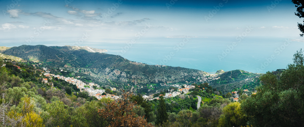 Scenic view of mountains with houses by Mediterranean Sea