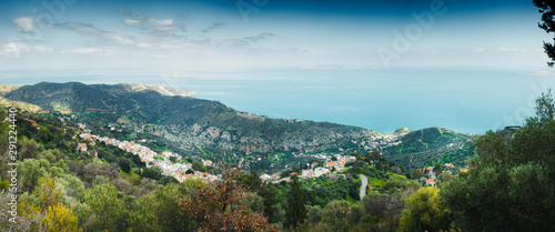 Scenic view of mountains with houses by Mediterranean Sea