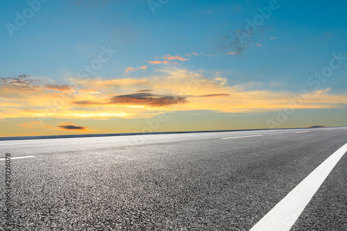 Empty asphalt highway and beautiful sunset clouds © ABCDstock
