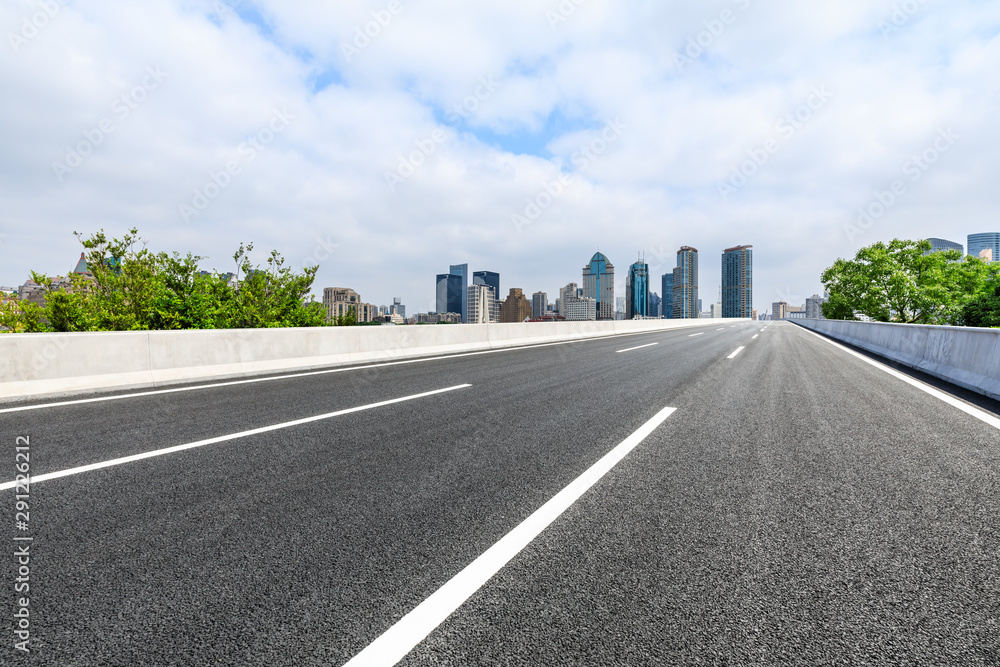 Empty asphalt highway and city skyline with buildings in Shanghai,China. Empty asphalt highway and city skyline with buildings in Shanghai,China.