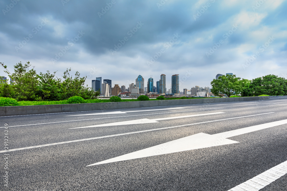 Fototapeta premium Empty asphalt highway and city skyline with buildings in Shanghai,China.