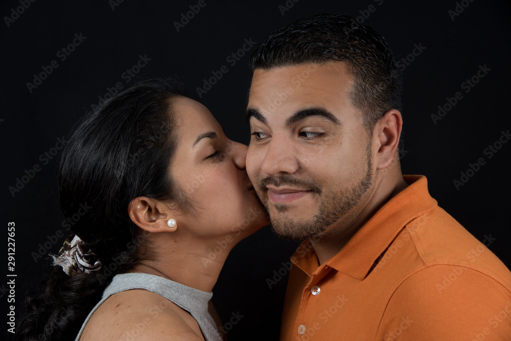 Woman kissing man. Happy couple. loving couple, only you and me. Black background Woman kissing man. Happy couple. loving couple, only you and me. Black background