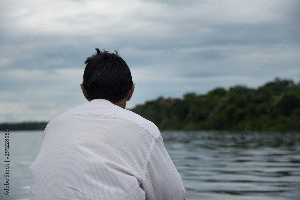 Indigenous man back view in Vaupés river. Colombia Indigenous man back view in Vaupés river. Colombia