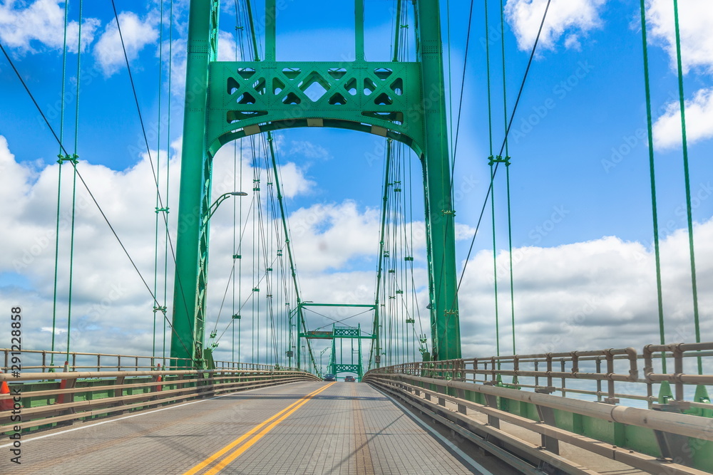 Fototapeta premium Saint Lawrence River bridge crossing from 1000 islands in Ontario, Canada to USA, New York