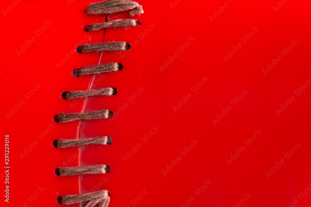 Texture stitching shoe lace in red plastic background Texture stitching shoe lace in red plastic background