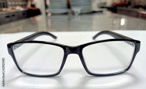 The front view of the glasses is clearly visible, placed on a white background.