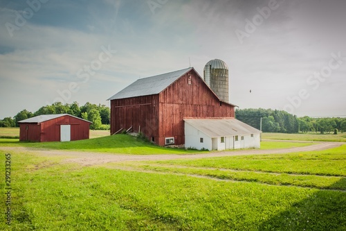 Beautiful old barn with a milkhouse in a field of rural areas of Pennsylvania photo