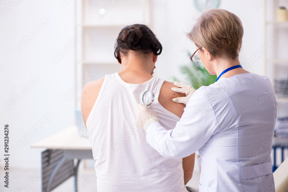 Young patient visiting doctor in hospital Young patient visiting doctor in hospital