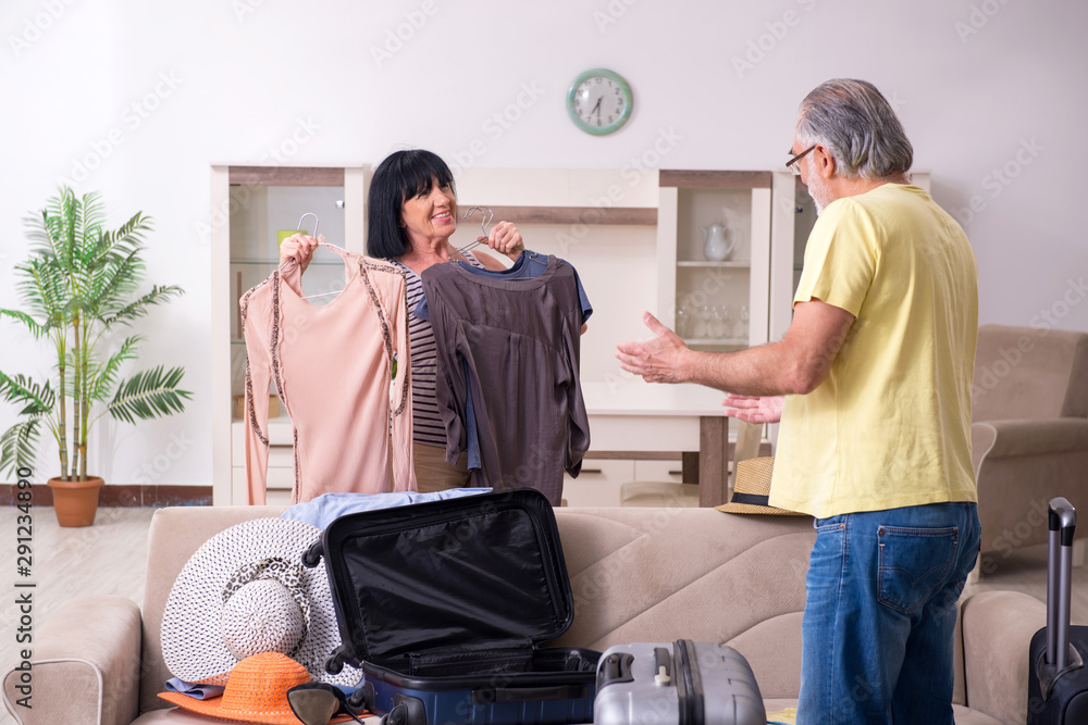 Old couple preparing for vacation travel Old couple preparing for vacation travel