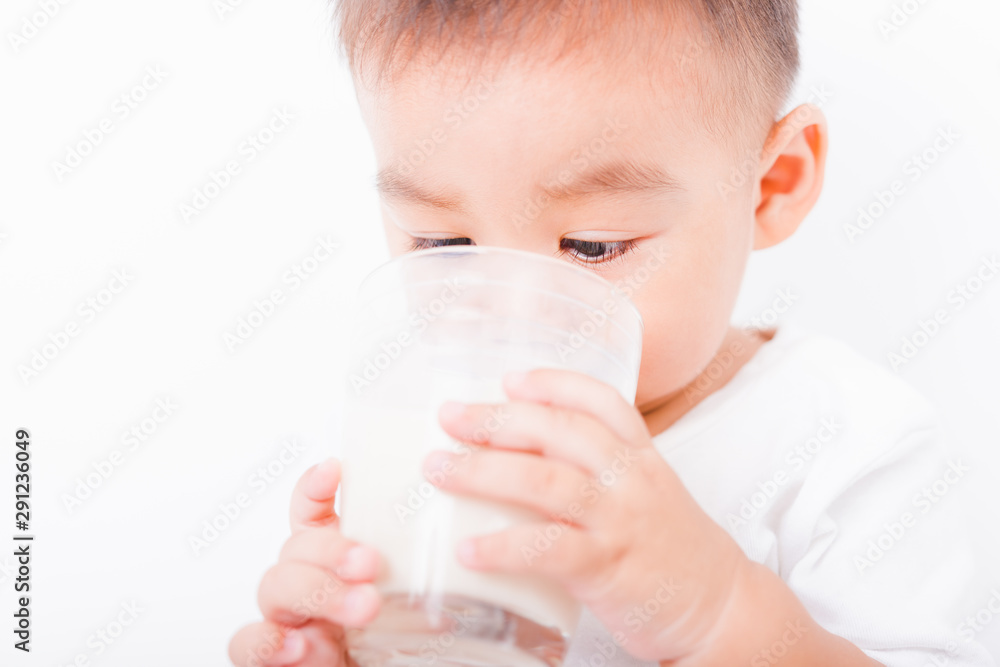 Asian portrait child boys 1 year 6 months drinking milk on glass Asian portrait child boys 1 year 6 months drinking milk on glass