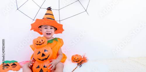 Happy Halloween Day. Little childhood with orange pumpkin Jack © sorapop