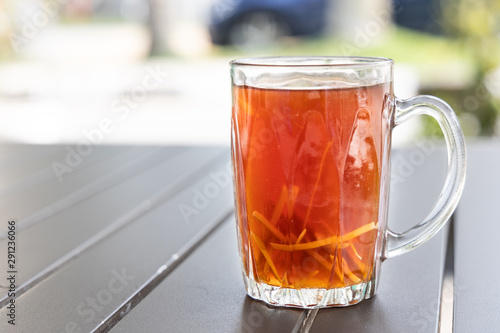 Black tea with ginger slice or known as Teh O Halia photo