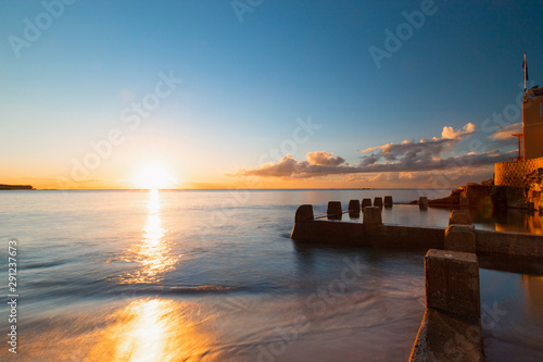 Photography Sunrise view of Coogee beach with the pool on the side.