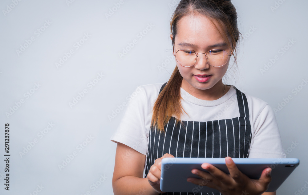 Young Asian woman using tablet for business concept, business concept with copy space Young Asian woman using tablet for business concept, business concept with copy space