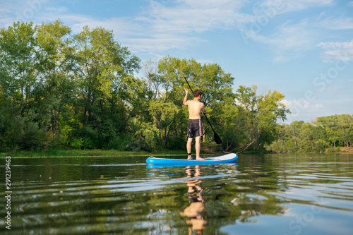 Man is training on a SUP board