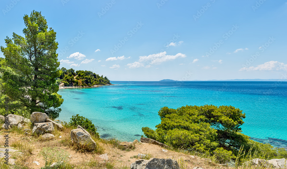 Rocky coastline and a beautiful clear water at Halkidiki peninsula in Greece Rocky coastline and a beautiful clear water at Halkidiki peninsula in Greece