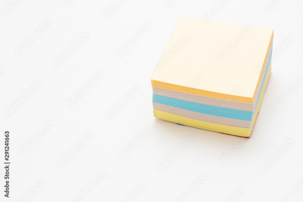multicolored stack of stickers on a white background