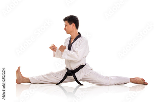 Male martial artist split sideways profile isolated