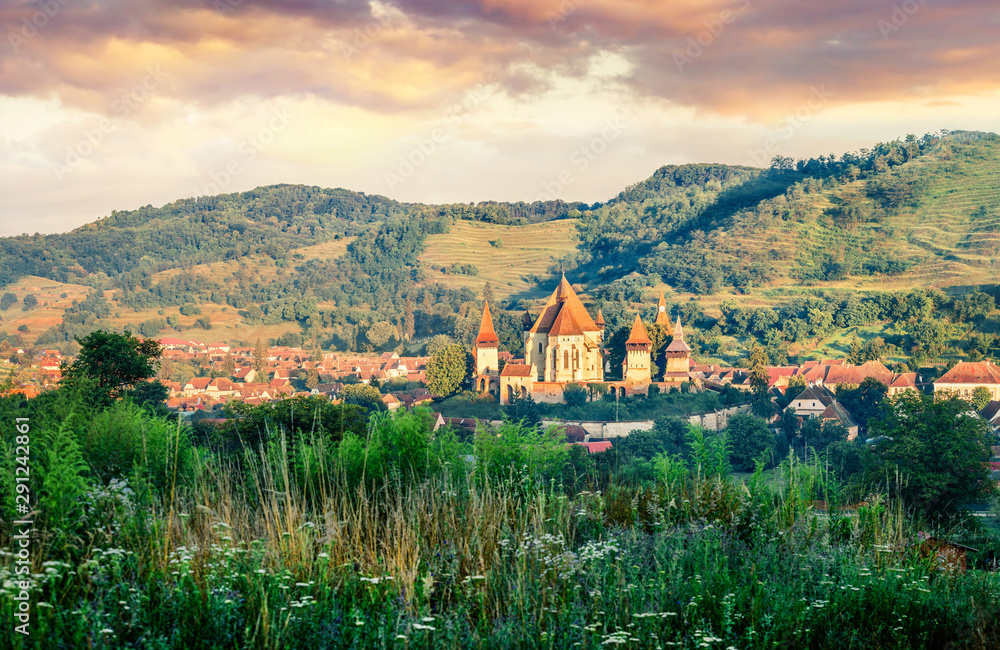 Picturesque summer view of Fortified Church of Biertan, UNESCO World Heritage Sites since 1993. Sunny morning cityscape of Biertan town, Transylvania, Romania, Europe. Traveling concept background.