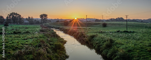 A sunrise over Trentham in Staffordshire. Pictured running through the landscape is a small stream called Longton Brook