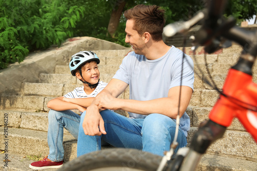 Happy father and son with b...