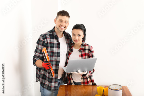 Happy couple with laptop du...