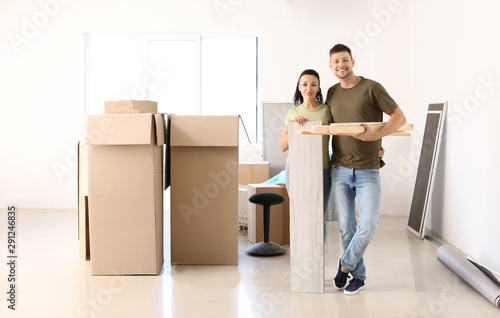 Happy couple doing repair i...