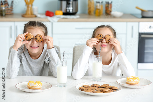 Portrait of funny twin girl...