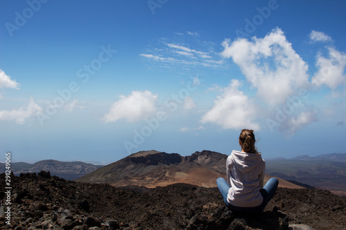 woman meditation on top of rock