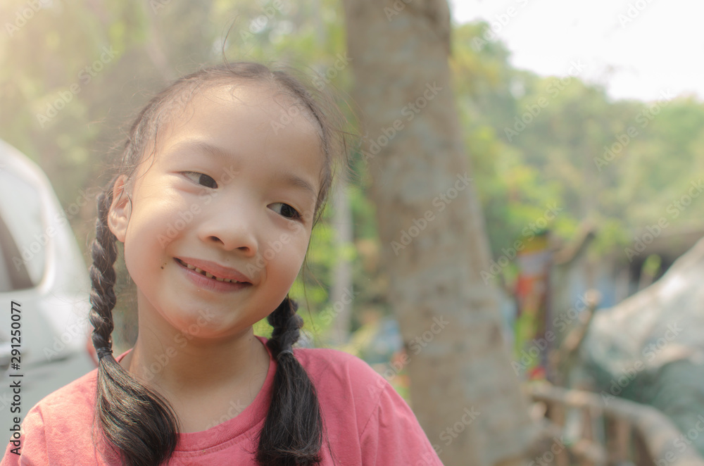Little girl happy and smiling with nature background Little girl happy and smiling with nature background
