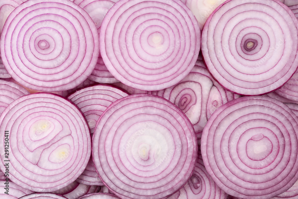 Onion slices as a background. Top view. Onion slices as a background. Top view.