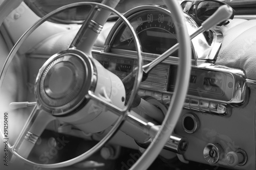 beautiful steering wheel and dashboard design of a retro car © guppys