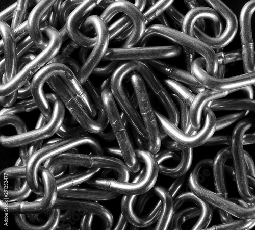 Metal chain on black background and texture