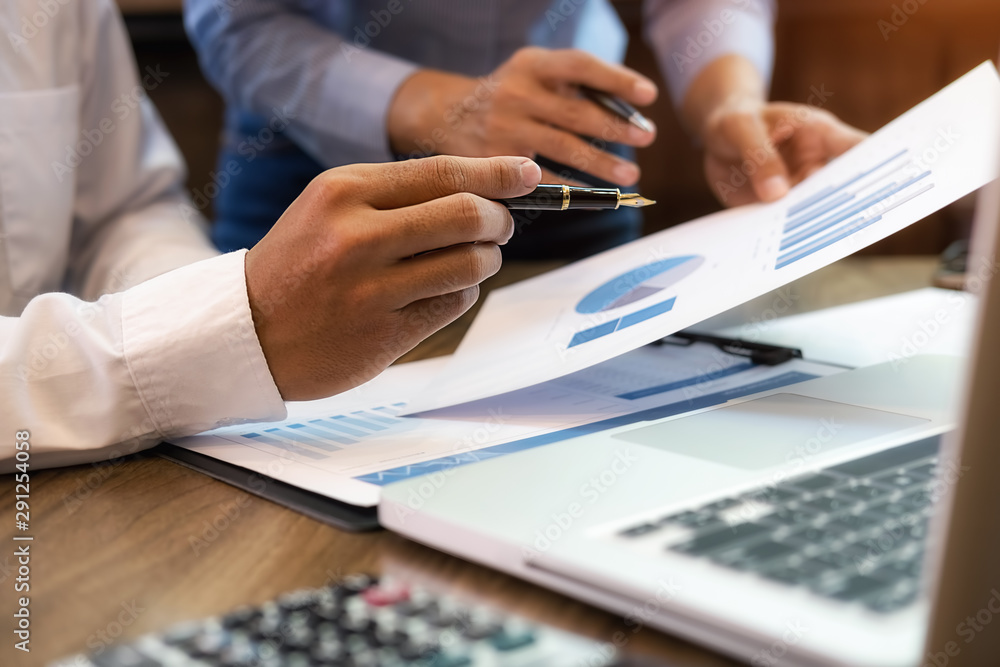 Business team brainstorming and discussing with financial data and report graph. Teamwork meeting working concept. Business team brainstorming and discussing with financial data and report graph. Teamwork meeting working concept.