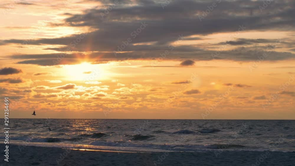 People relaxing on the beach of Baltic Sea at sunset. People relaxing on the beach of Baltic Sea at sunset.