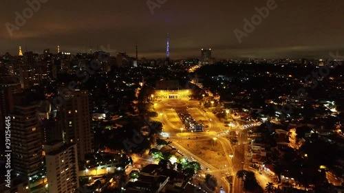 Cityscape of illuminated Pacaembu Stadium, in the nightlife of Sao Paulo, Brazil. Nightlife view of illuminated cityscape of soccer stadium. Cityscape scene. Illuminated nightlife view. Stadium view. photo