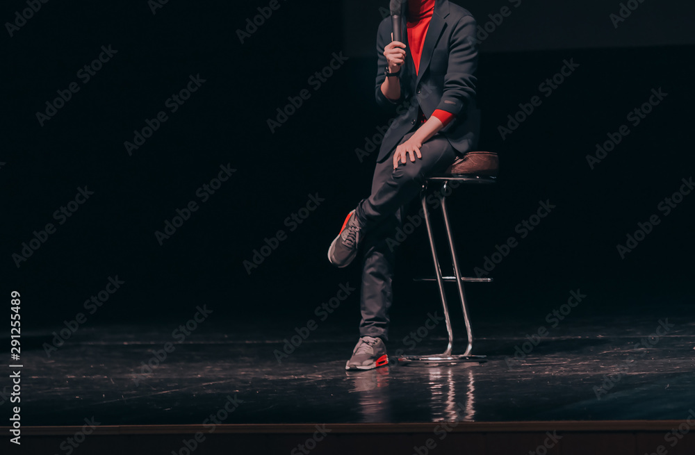 businessman, makes a report at a corporate meeting