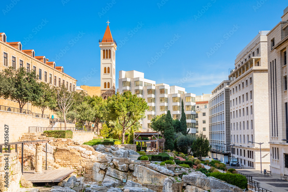 Naklejka premium Roman baths ancient ruins site, modern buidings and Saint Louis Cathedral of the Capuchin Fathers Latin Catholic church in the downtown of Beirut, Lebanon