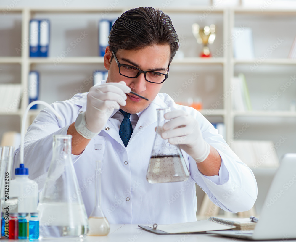 Young researcher scientist doing a water test contamination expe Young researcher scientist doing a water test contamination expe