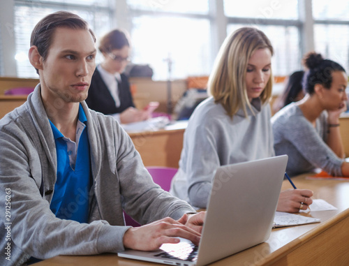 Wallpaper Mural Man with laptop among students in an auditorium Torontodigital.ca