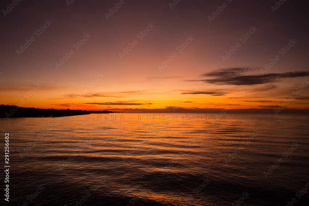 Beautiful of cloud and sky with reflection over sea at sunset,at sunrise