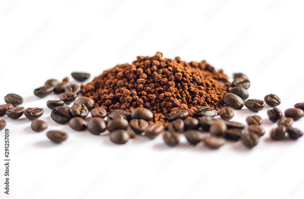 Closeup of coffee powder with soft focus of coffee bean. isolated on white Closeup of coffee powder with soft focus of coffee bean. isolated on white