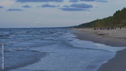 Wallpaper Mural People relaxing on the beach of Baltic Sea at sunset. Torontodigital.ca