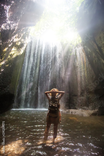 Woman near waterfal on Bali  Indonesia  