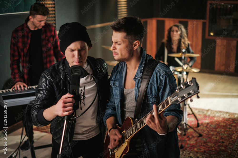 Music band having rehearsal in a studio Music band having rehearsal in a studio
