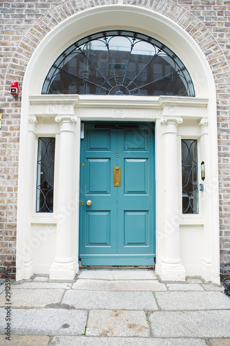 A blue door in Dublin, Ireland. Arched Georgian door house front