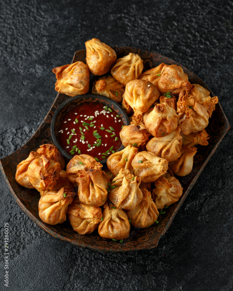 Chinese takeaway finger food Vegetable wontons with sweet chilli dip sauce Chinese takeaway finger food Vegetable wontons with sweet chilli dip sauce