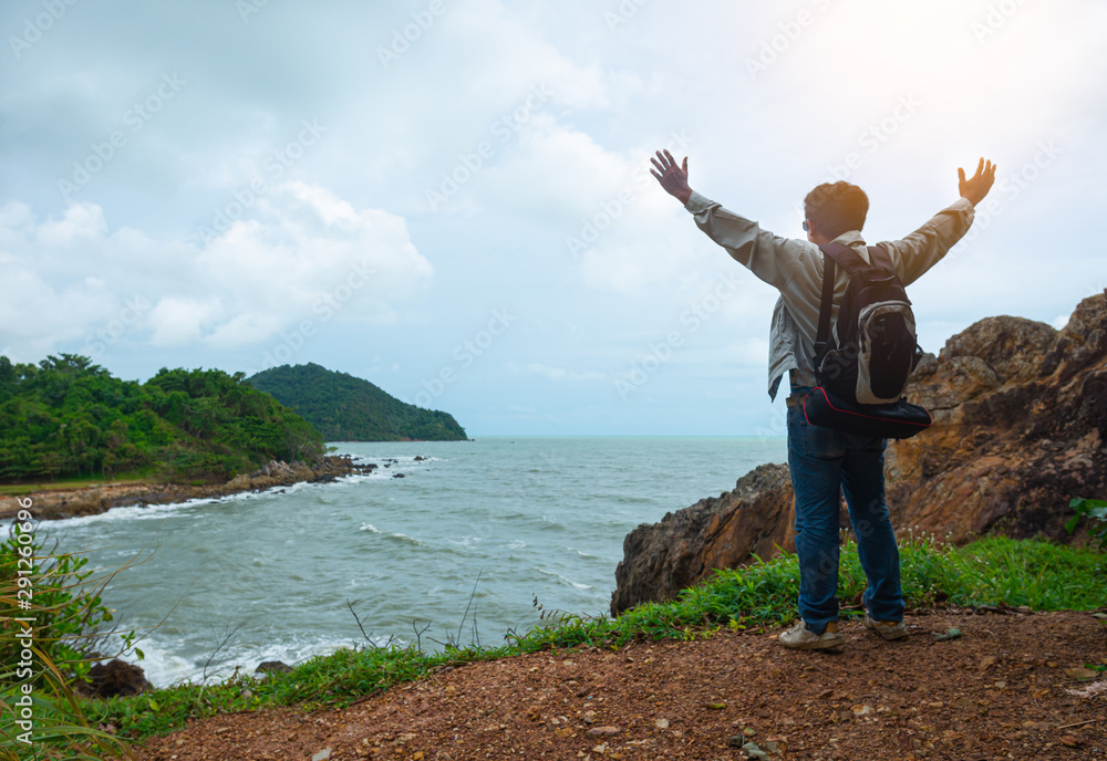 A man is standing on the cliff A man is standing on the cliff